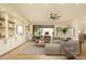 Bright living room boasts modern built-ins, neutral decor, light hardwood flooring and an inviting seating area at 5402 E Michelle Dr, Scottsdale, AZ 85254