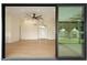 Open-concept living room featuring hardwood floors, recessed lighting, and sliding glass doors at 5402 E Michelle Dr, Scottsdale, AZ 85254