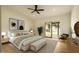 Serene main bedroom featuring a sliding glass door and a neutral color palette at 5402 E Michelle Dr, Scottsdale, AZ 85254
