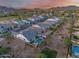 Aerial view of home featuring a pool and spa oasis, desert landscaping, and mountain views at 5901 E Sierra Morena St, Mesa, AZ 85215