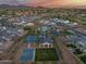 Scenic aerial view of community amenities, including a pool, sports courts, and green spaces at 5901 E Sierra Morena St, Mesa, AZ 85215