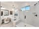Bright bathroom features dual vanities, makeup vanity, soaking tub, and walk-in shower at 5901 E Sierra Morena St, Mesa, AZ 85215