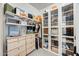 Walk-in closet with custom shelving and cabinets for ample storage at 5901 E Sierra Morena St, Mesa, AZ 85215