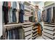 Walk-in closet with wire shelves and clothing hanging in an organized manner at 5901 E Sierra Morena St, Mesa, AZ 85215