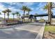 Community entrance featuring lush landscaping and stylish signage at Reserve at Red Rock at 5901 E Sierra Morena St, Mesa, AZ 85215