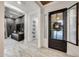 Inviting entryway with dark door, tiled floor, and views to the formal living room at 5901 E Sierra Morena St, Mesa, AZ 85215