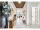 Bright hallway featuring wood plank ceiling, a decorative table, bench and white walls at 5901 E Sierra Morena St, Mesa, AZ 85215