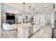 Open-concept kitchen flows to the living area and offers granite countertops, stainless steel appliances, and pendant lighting at 5901 E Sierra Morena St, Mesa, AZ 85215