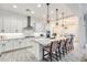 Modern kitchen with white cabinets, stainless steel appliances, and a large center island at 5901 E Sierra Morena St, Mesa, AZ 85215