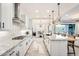 Well-lit kitchen featuring granite countertops, stainless steel appliances, and a center island that opens to an eat in dining area at 5901 E Sierra Morena St, Mesa, AZ 85215