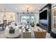 Open-concept living room boasts fireplace, neutral palette, and a wall of sliding glass doors at 5901 E Sierra Morena St, Mesa, AZ 85215