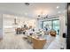Spacious living room featuring a modern kitchen, fireplace, and stylish decor at 5901 E Sierra Morena St, Mesa, AZ 85215