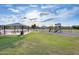Community playground with picnic tables and play structures, perfect for Gathering fun at 5901 E Sierra Morena St, Mesa, AZ 85215