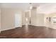 Open living room with hardwood floors, neutral walls, and ample natural light from many windows at 7002 E Exmoor Dr, Mesa, AZ 85208