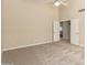 Relaxing bedroom featuring carpeted floors, a ceiling fan, and neutral paint at 7002 E Exmoor Dr, Mesa, AZ 85208