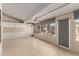 Well-lit sun room with tile flooring, ceiling fan and access to the outdoor space at 7002 E Exmoor Dr, Mesa, AZ 85208