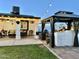 Relaxing outdoor space with patio, gazebo, and string lights, perfect for entertaining guests in the backyard at 7943 W Mariposa Dr, Phoenix, AZ 85033