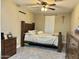 Traditional bedroom with a wooden bed, shuttered window and carpeted floor at 7943 W Mariposa Dr, Phoenix, AZ 85033