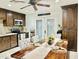Cozy dining area featuring a wooden table, upholstered chairs, and stylish decor at 7943 W Mariposa Dr, Phoenix, AZ 85033