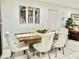 Stylish dining area featuring a wooden table, upholstered chairs, and modern decor at 7943 W Mariposa Dr, Phoenix, AZ 85033