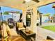 Inviting outdoor patio with comfortable seating, string lights, and well-manicured landscaping at 7943 W Mariposa Dr, Phoenix, AZ 85033