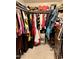 Spacious walk-in closet with extensive hanging space, shelving, and storage drawers at 7943 W Mariposa Dr, Phoenix, AZ 85033