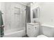 Modern bathroom with tiled shower, granite countertop, and sink at 819 N Robson --, Mesa, AZ 85201