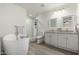 Bright bathroom featuring a soaking tub, walk-in shower, and double sink vanity with granite countertops at 819 N Robson --, Mesa, AZ 85201