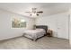Calm bedroom with tile floors, ceiling fan, window, and simple decor at 819 N Robson --, Mesa, AZ 85201