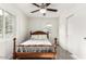 Bedroom featuring a fan, wood-look floors, and a window providing bright, natural light at 819 N Robson --, Mesa, AZ 85201