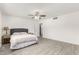 This bedroom is bright and spacious with tile floors, ceiling fan, and ensuite bathroom at 819 N Robson --, Mesa, AZ 85201