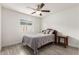 Cozy bedroom features a comfortable bed, stylish wood-look flooring, and a window at 819 N Robson --, Mesa, AZ 85201