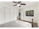 Bedroom featuring a ceiling fan, closet, wood-look floors, and bright, natural light at 819 N Robson --, Mesa, AZ 85201