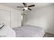 This bedroom features stylish flooring, a ceiling fan, and access to a closet at 819 N Robson --, Mesa, AZ 85201