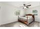 Bedroom featuring light gray wood-look floors, ceiling fan, and bright, natural light from two windows at 819 N Robson --, Mesa, AZ 85201