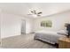 Spacious bedroom with neutral colors, tile floors, ceiling fan, and natural light at 819 N Robson --, Mesa, AZ 85201