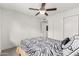 Bedroom featuring wood-look floors, ceiling fan, and a closet for storage and organization at 819 N Robson --, Mesa, AZ 85201