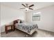 Bedroom featuring wood-look floors, a window providing natural light, and a ceiling fan at 819 N Robson --, Mesa, AZ 85201