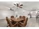 Bright dining room featuring wood table, six chairs, open floor plan, and tile flooring at 819 N Robson --, Mesa, AZ 85201