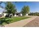 Inviting single-story home with mature trees and a lush green lawn at 819 N Robson --, Mesa, AZ 85201