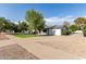 Well-maintained single-story home with a lush front lawn and ample parking space at 819 N Robson --, Mesa, AZ 85201