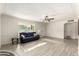 Spacious living room with a ceiling fan, neutral walls, and hardwood-style flooring at 819 N Robson --, Mesa, AZ 85201