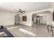 Open living room with light-colored walls, wood-look flooring, and a modern ceiling fan at 819 N Robson --, Mesa, AZ 85201