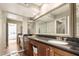 Bathroom features a large mirror, double sinks, and sleek black countertops at 8306 E Via De Dorado --, Scottsdale, AZ 85258