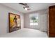 This bedroom features neutral walls, carpeted floors, a ceiling fan, and a window letting in plenty of natural light at 8306 E Via De Dorado --, Scottsdale, AZ 85258