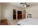 Bedroom with ensuite bathroom, ceiling fan and nice natural lighting at 8306 E Via De Dorado --, Scottsdale, AZ 85258