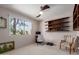 Bedroom features a large window, dark wood shelves, an office chair and a sitting chair at 8306 E Via De Dorado --, Scottsdale, AZ 85258
