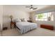 Bedroom bathed in light from a large window and including a ceiling fan at 8306 E Via De Dorado --, Scottsdale, AZ 85258