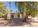 Attractive single-story home featuring desert landscaping, flowering bushes and mature trees at 8306 E Via De Dorado --, Scottsdale, AZ 85258