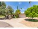 Well-maintained single-story home with a two-car garage, mature trees, and inviting curb appeal at 8306 E Via De Dorado --, Scottsdale, AZ 85258